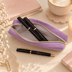 Black ballpoint pens in a lilac velvet pencil case