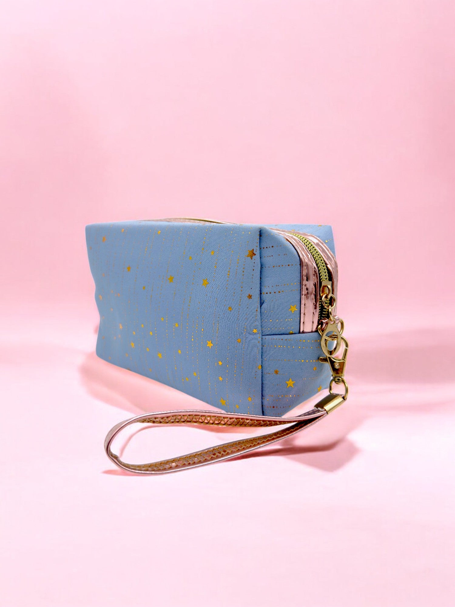 Large sparkly blue pencil case with waterproof lining and rose gold strap for stationery