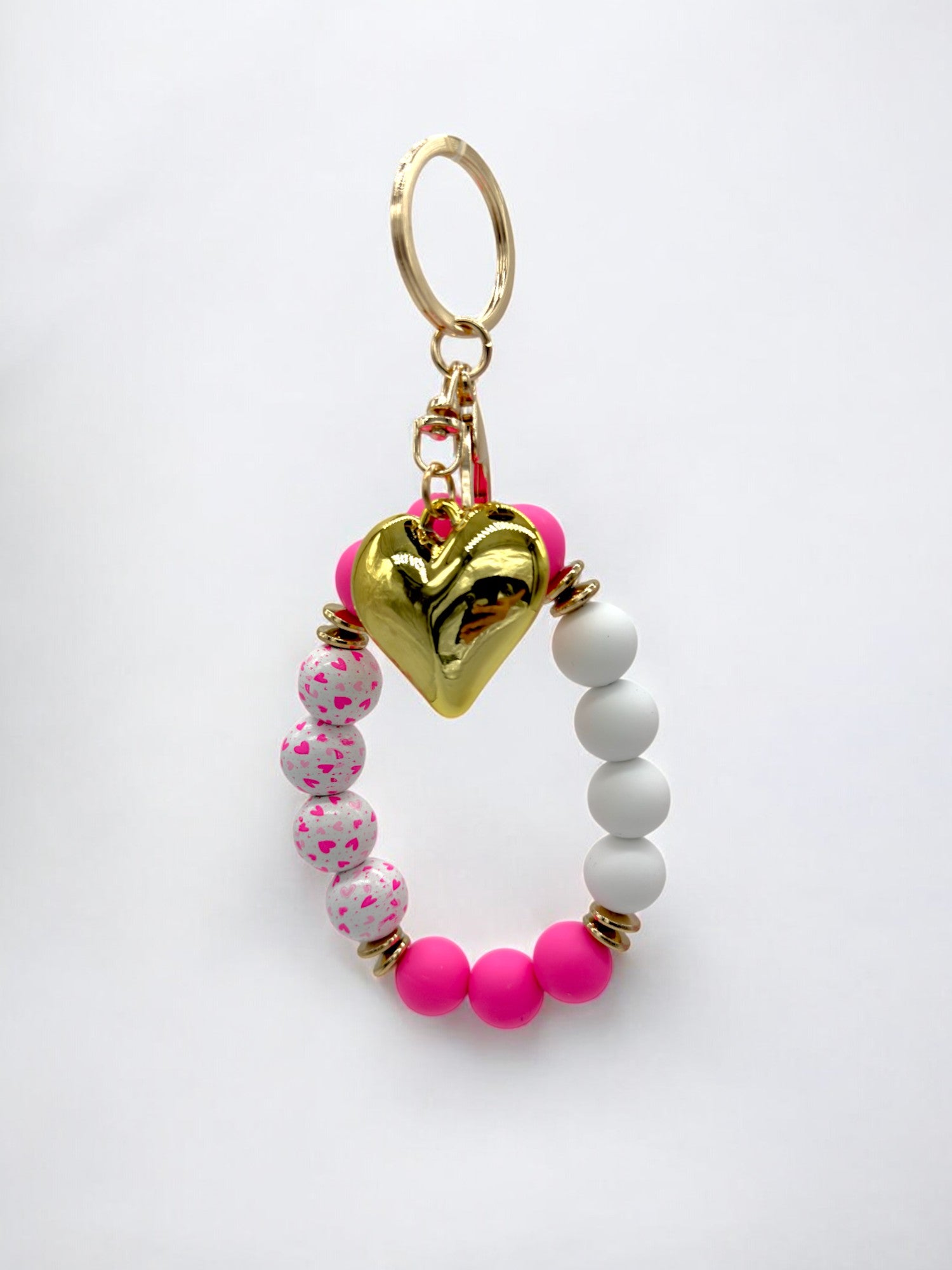 Neon pink and white stretchy beaded bracelet keychain with gold heart