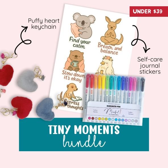 Promotional image of 'Tiny Moments' bundle with puffy heart keychain, self-care journal stickers, and highlighters.