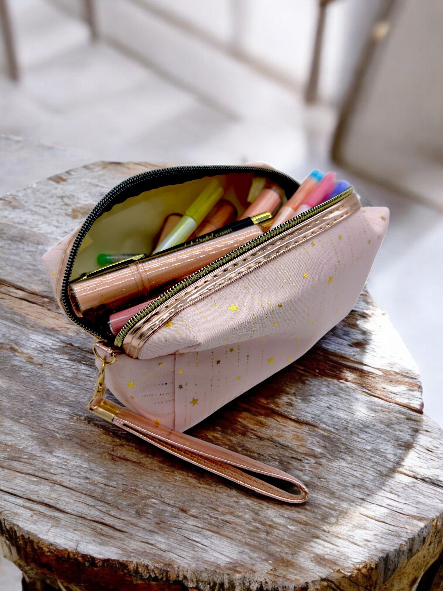Stationery in a light pink Rose gold strap pouch open with glittery finish, ideal for travel or school supplies