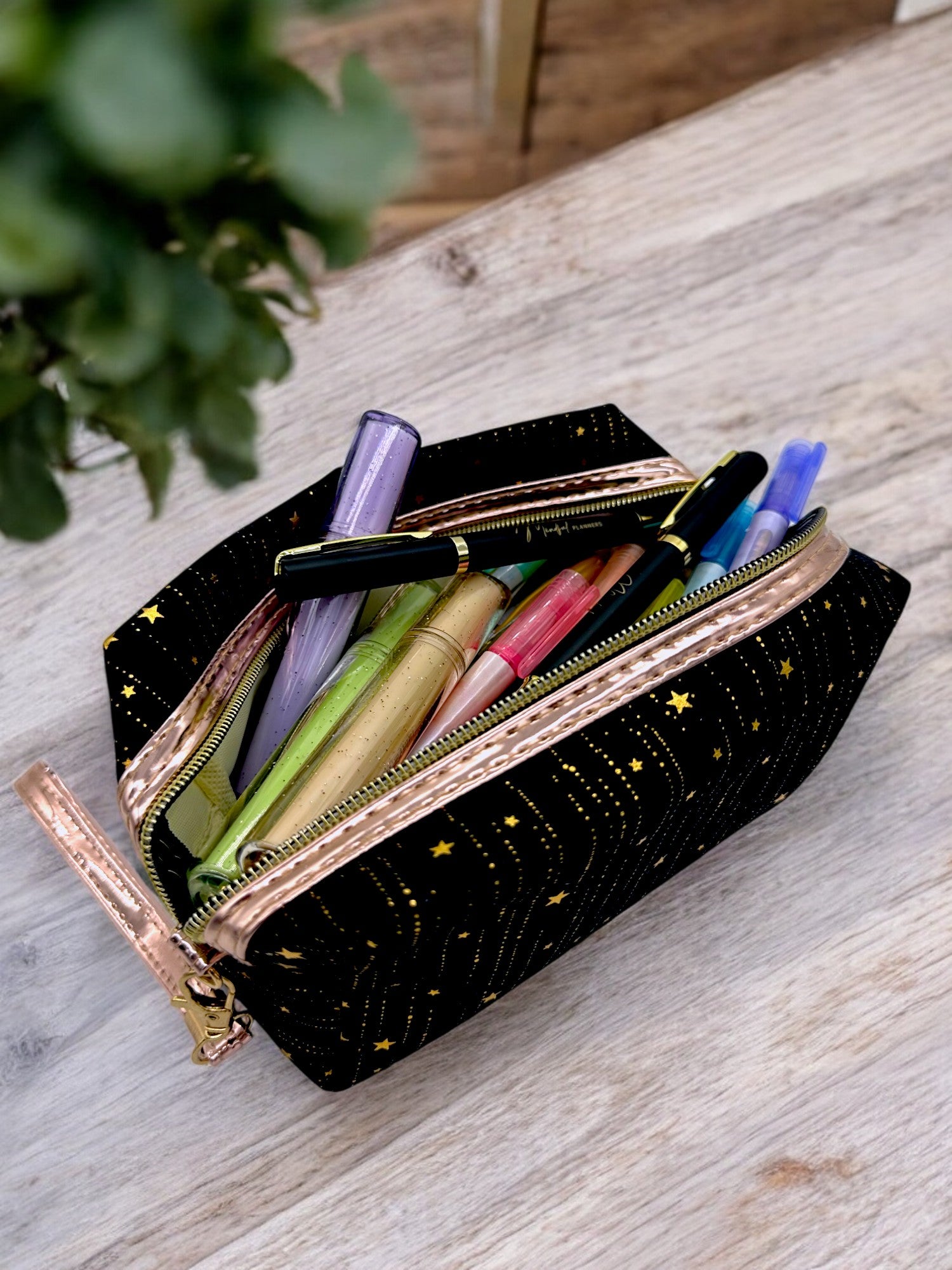Stationery, markers and pens in a Multi-use black glitter pouch perfect for makeup, hygiene items, or swimwear storage