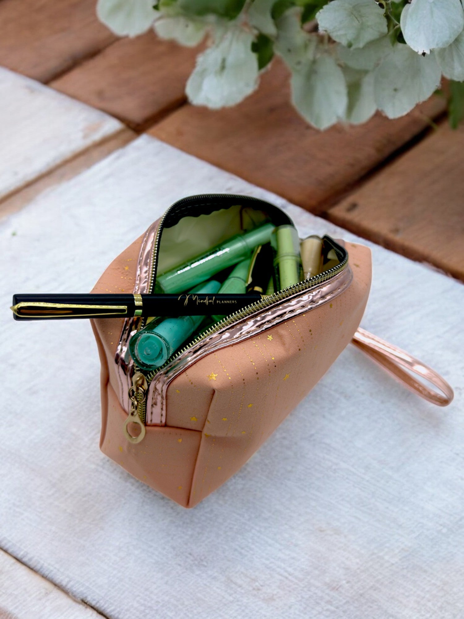 Stationery, markers and pens in a Multi-use glitter pouch perfect for makeup, hygiene items, or swimwear storage