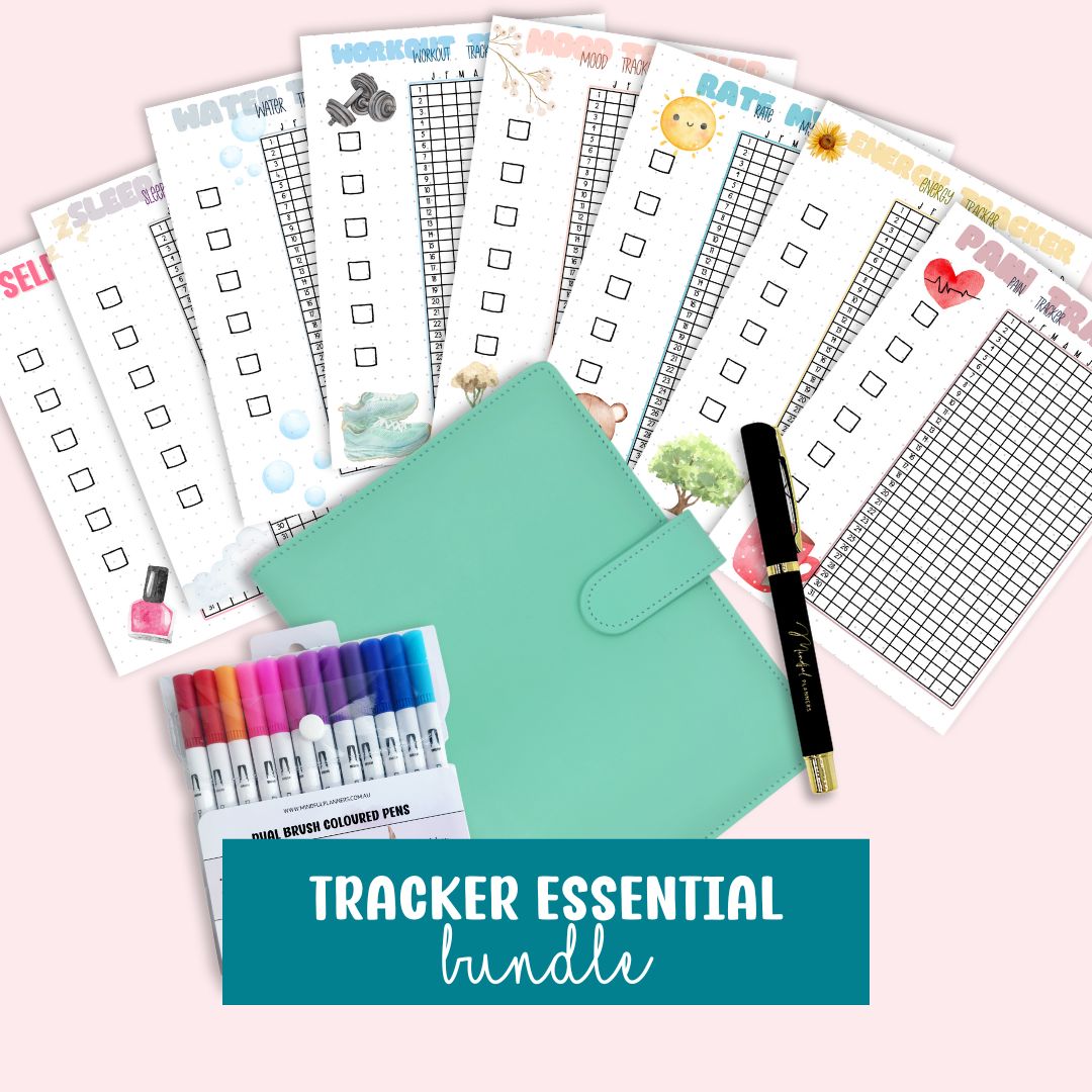 Tracker essential bundle with checklists, pens, and a pen holder on a pink background.