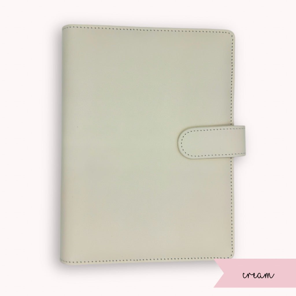 Cream-colored planner cover on a white background