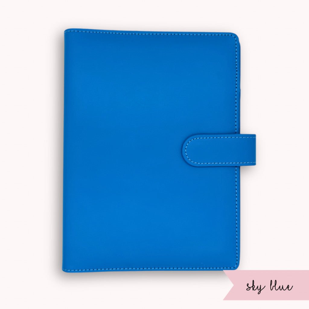 Blue notebook cover with a strap on a white background