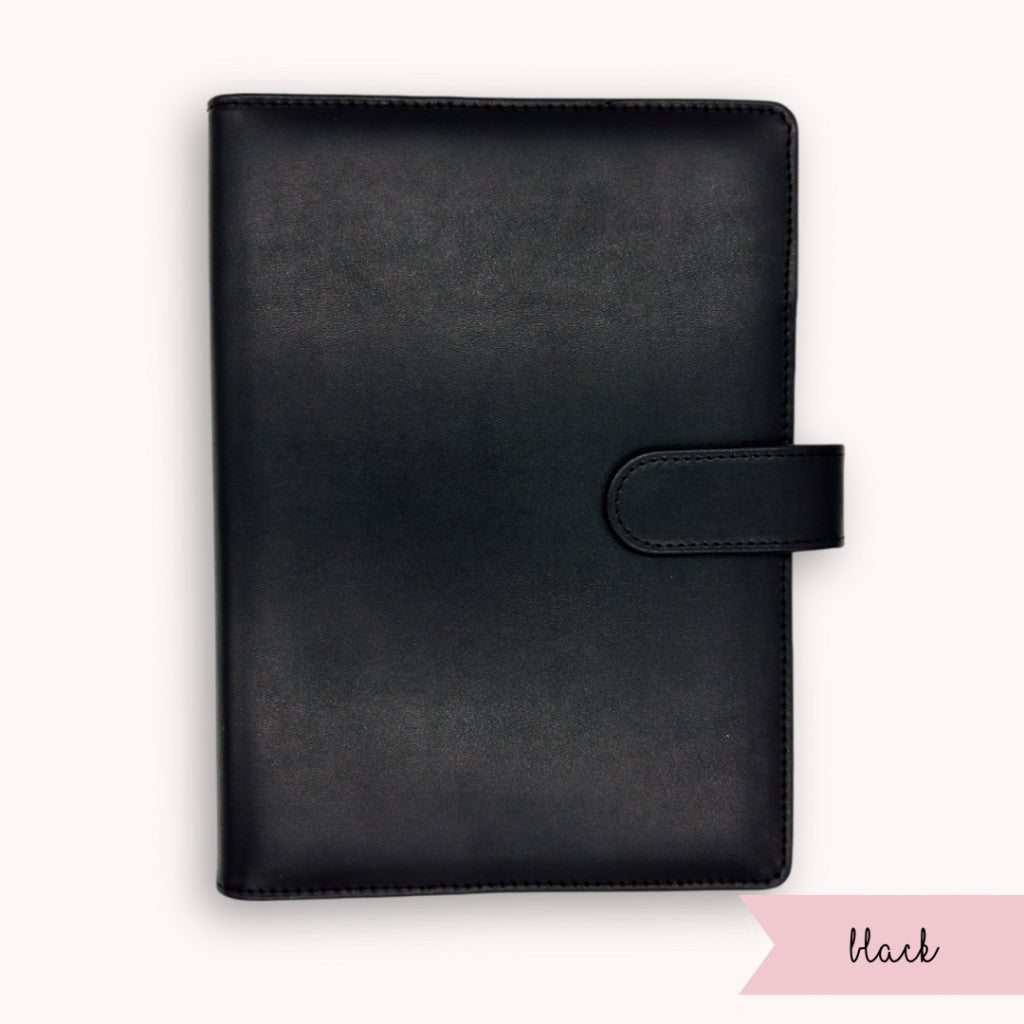 Black leather planner cover on a white background