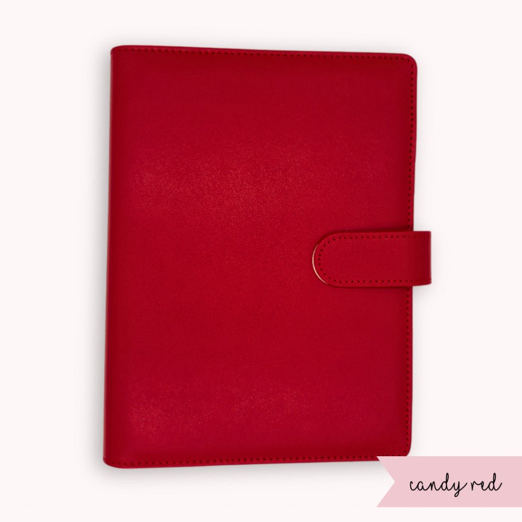 Red planner cover with a strap on a white background