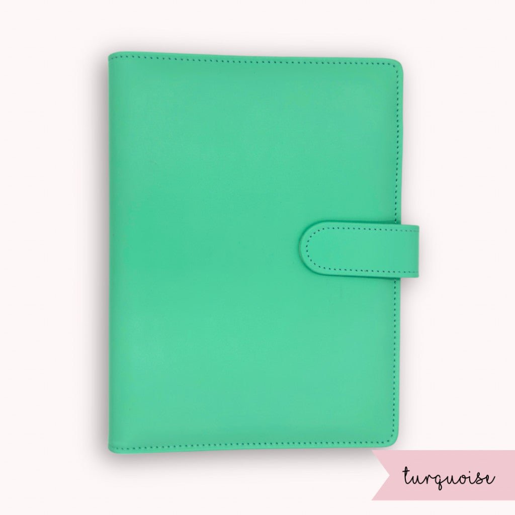 Turquoise planner cover on a white background